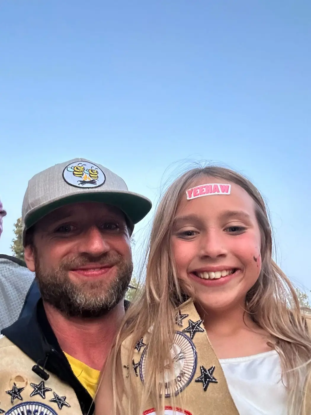 A Wildcat dad and daughter smiling together
